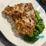 Crispy air fryer parmesan chicken breasts served over rice