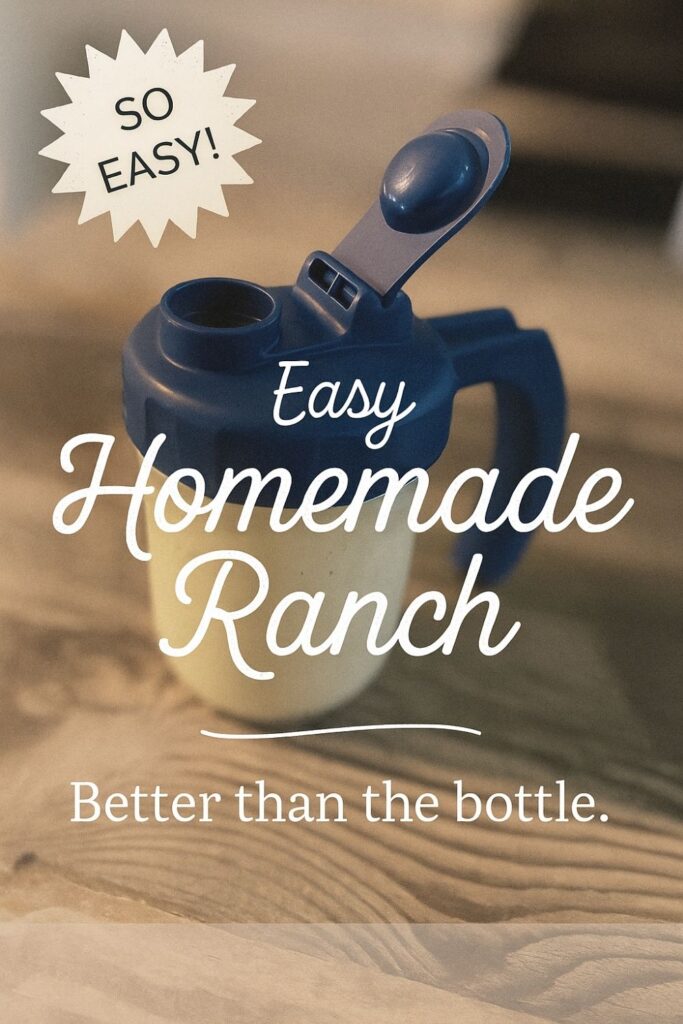 Homemade ranch dressing in a mason jar with a blue flip-top lid, sitting on my rustic farmhouse kitchen island.