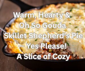 shepherd’s pie with ground beef in a cast iron skillet topped with golden mashed potatoes and smoked gouda
